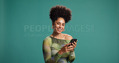 Buy stock photo Phone, smile and portrait of woman in studio for social media, message or fashion blog. Mobile, online chat and happy African model on app for news, trendy article and mockup space on background