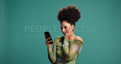 Buy stock photo Surprise, cellphone and woman in studio, wow and announcement on green background. Person, mobile user and smartphone with facial expression, space and shocked with emoji, gossip and notification