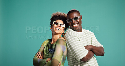Buy stock photo Fashion, arms crossed and laughing with couple in studio for style, sunglasses and support. Happiness, relationship and clothes pride with African man and woman on green background for love together