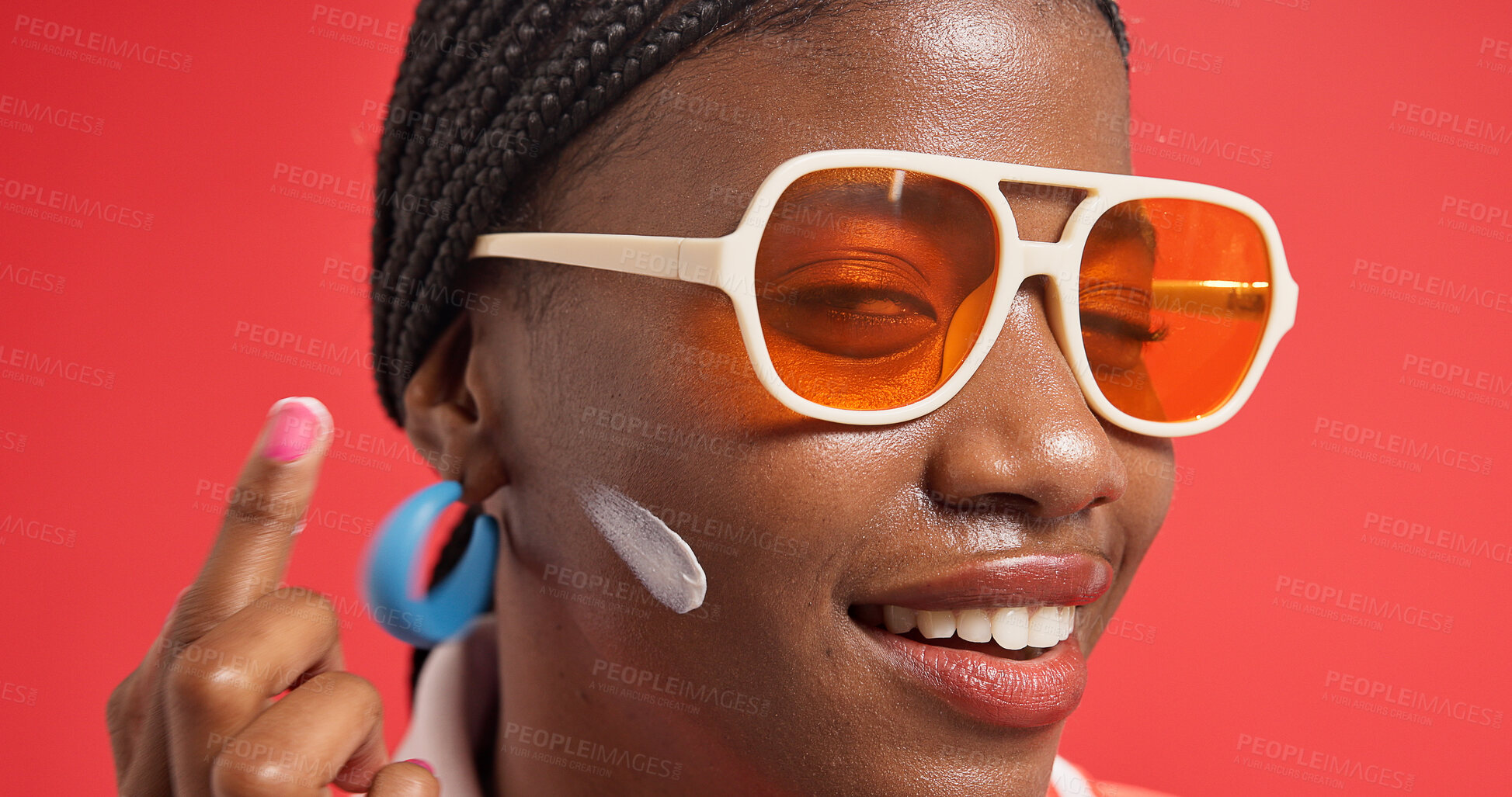 Buy stock photo Black woman, face and cream for skincare, hydration and moisturizer treatment with cosmetics in studio. Aesthetic, person and model with product for facial lotion, glow or wellness on red background