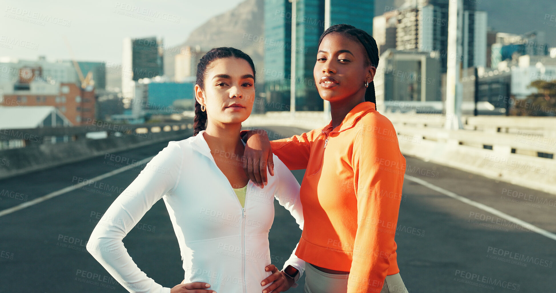 Buy stock photo Serious, women and athletes in city for fitness, running or workout together on bridge. Confident, sports and portrait of female people with bonding for cardio exercise or training in urban town.