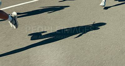 Buy stock photo Shadow, running and street with people in city for speed, marathon and training group. Health, fitness and wellness with runner club in road outdoor for workout, exercise and cardio challenge
