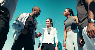 Buy stock photo Runner, group and coach in huddle, motivation and support for training, listen and fitness in city. People, mentor and smile with circle, start and low angle with advice, challenge and exercise club