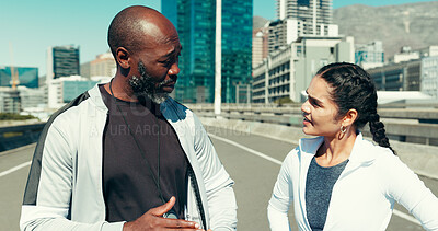 Buy stock photo Talking, fitness and personal trainer with people in city for workout, discussion and client training. Exercise, coaching and advice with man and woman outdoor for performance, cardio and runner