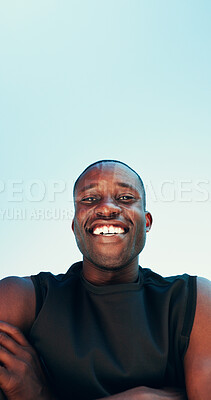 Buy stock photo Below, fitness and portrait of happy black man on blue sky for running, exercise and workout. Space, crossed arms and person with smile for marathon training, sports and challenge for endurance