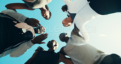 Buy stock photo Huddle, running and coaching with friends in city for support, fitness club or motivation. Sports challenge, exercise and personal trainer with low angle of people for wellness, training and marathon