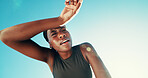 Fitness, tired and black woman wipe sweat for health, wellness or exhausted by blue sky. Runner, fatigue and relax on break outdoor for intense exercise, breathing or rest for recovery with low angle