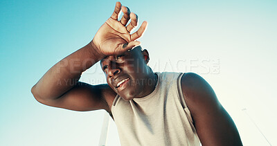 Buy stock photo Fitness, tired and black man wipe sweat outdoor for health, wellness and exhausted on break. Runner, fatigue and rest to relax by blue sky for exercise, recovery and breathing with low angle