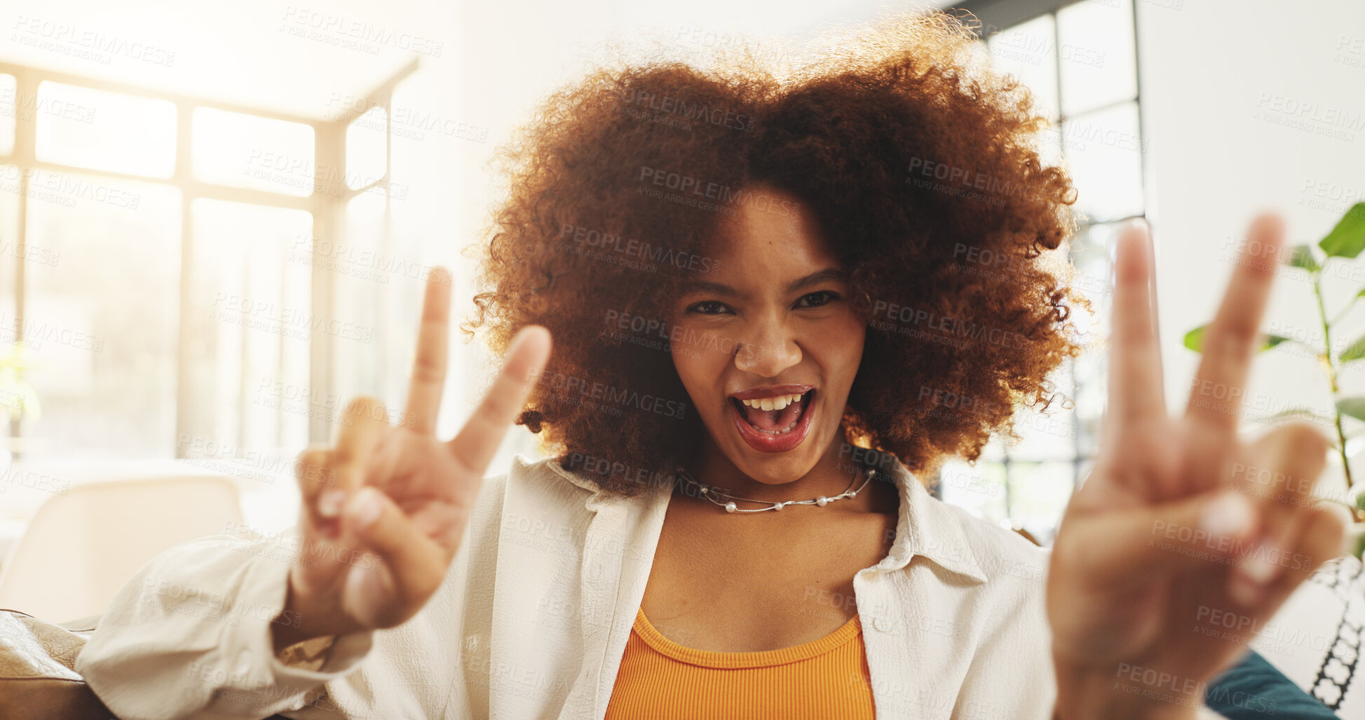 Buy stock photo Woman, happy and peace sign on sofa in portrait, excited and relax in living room at apartment. Girl, smile and face with symbol, gesture and v emoji on couch in lounge with at house in Costa Rica
