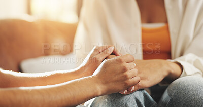 Buy stock photo Holding hands, support and couple on sofa in home with counseling for marriage repair together. Love, comfort and man with woman for connection in relationship with care, trust or compassion in house