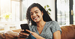 Woman, phone and happy with texting on couch, relax and laugh at funny meme on web at apartment. Person, smartphone and smile in home, mobile app and chat notification on social media in living room