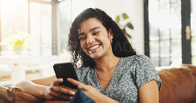 Buy stock photo Woman, phone and happy with texting on couch, relax and laugh at funny meme on web at apartment. Person, smartphone and smile in home, mobile app and chat notification on social media in living room