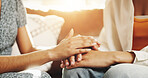 Friends, women and holding hands with comfort in home for divorce stress, empathy and support. Compassion, people and console on sofa for cheating mistake, understanding or sympathy for mental health
