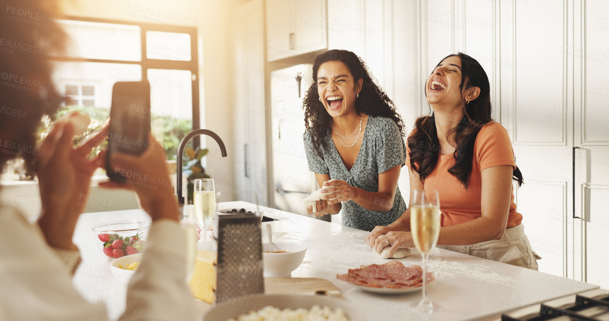 Buy stock photo Laughing, photography and cooking with friends in kitchen for help, bonding and support. Food, memory and dinner with group of women and meal prep in home for wine, reunion and party together