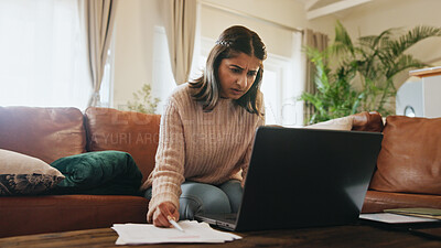 Buy stock photo Woman, finance and stress with laptop in home with documents, debt or fintech for payment on sofa. Person, paperwork and confused with review, bills or computer for credit score on couch at apartment