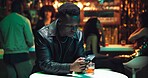 Phone, online dating and waiting with man in nightclub for relationship app, communication and party. Culture, meeting and social media with person at bar for disappointed, partner search and contact