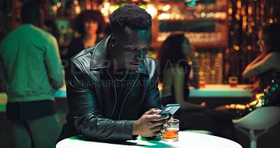 Buy stock photo Phone, online dating and waiting with man in nightclub for relationship app, communication and party. Culture, meeting and social media with person at bar for disappointed, partner search and contact