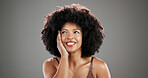 Beauty, black woman or thinking with skincare ideas with hydration results, space or shine. Afro, studio or happy person with healthy cosmetics, anti aging treatment or confidence on grey background