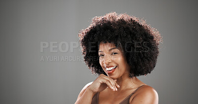 Buy stock photo Happy, hair and portrait of black woman in studio for beauty, healthy texture and growth. Smile, mockup space and person with natural hairstyle for wellness, grooming or shine on gray background
