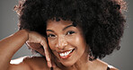 Smile, beauty and portrait of black woman in studio with natural hair, wellness and cosmetics. Happy, salon and face of person with afro hairstyle for texture, growth and shine on gray background