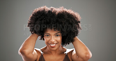 Buy stock photo Haircare, happy and woman with afro in studio with healthy texture, natural volume or growth. Space, black person and portrait on gray background with conditioning treatment or hairstyle maintenance