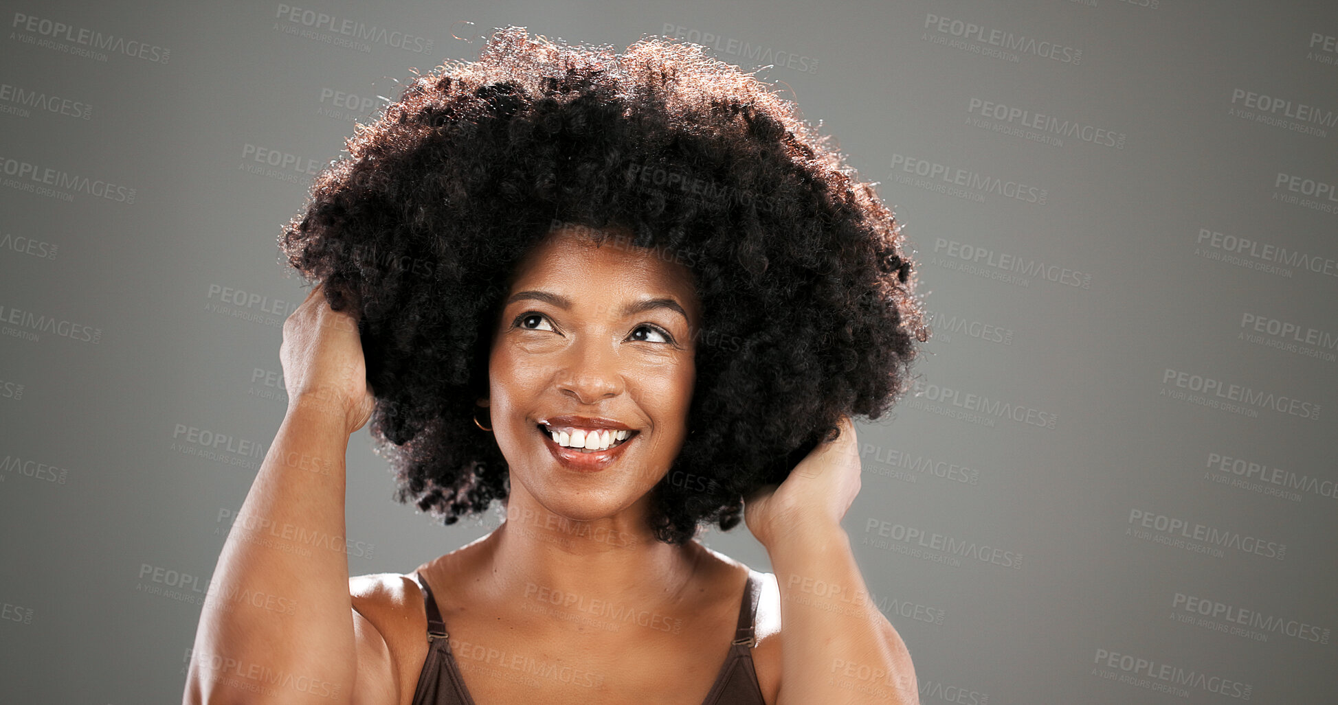 Buy stock photo Haircare, beauty and woman with afro in studio with healthy texture, growth results or volume. Mockup space, African person or confidence with hairstyle on gray background for grooming or maintenance