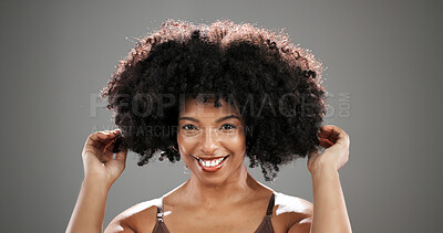 Buy stock photo African woman, hair care and smile in studio portrait with texture, results and keratin by background. Person, happy and growth with afro, confidence and hairstyle with touch for volume in Kenya