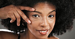 Touch, beauty and portrait of black woman in studio with natural hair, wellness and cosmetics. Smile, happy and face of person with afro hairstyle for texture, growth and shine on gray background