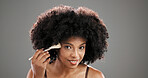 Makeup, brush and portrait of black woman on gray background for foundation, cosmetics and beauty products. Cosmetology, salon and person with tools for skincare, makeover and aesthetic in studio