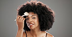 Makeup, brush and portrait of black woman in studio for foundation, cosmetics and beauty products. Cosmetology, salon and person with tools for skincare, makeover and aesthetic on gray background
