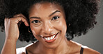 Haircare, portrait and woman with afro in studio with healthy texture, growth results and volume. Beauty glow, african person and happy with hairstyle on gray background for self care and maintenance