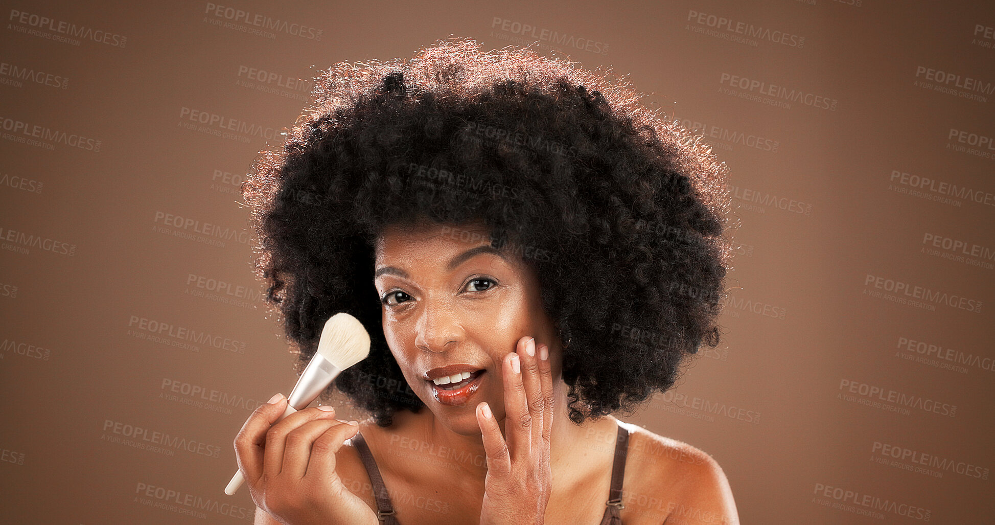Buy stock photo Makeup brush, beauty and portrait of black woman in studio for cosmetics, foundation and skincare. Cosmetology, brown background and African person with tools to apply products, shine and makeover