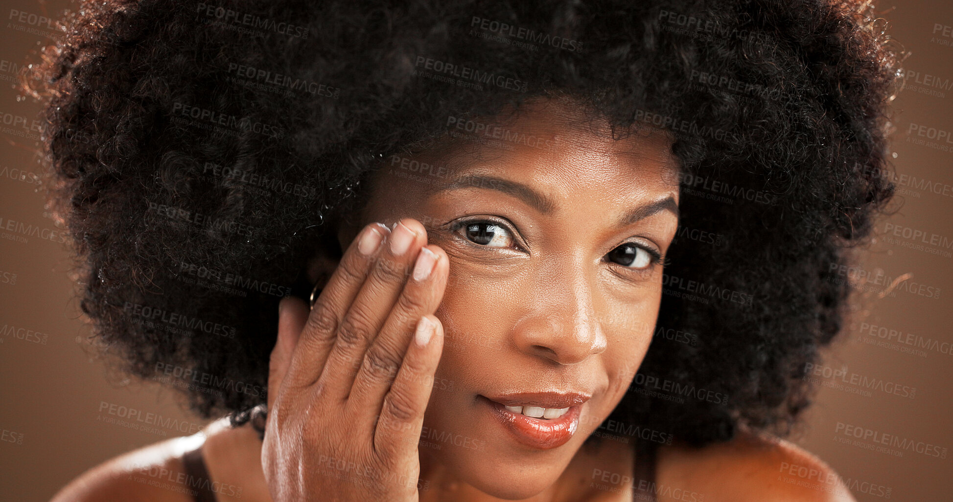 Buy stock photo Beauty, facial and portrait with black woman in studio for antiaging or moisturizing routine. Face, lotion and skincare with African model on wall background for cosmetics, dermatology or wellness