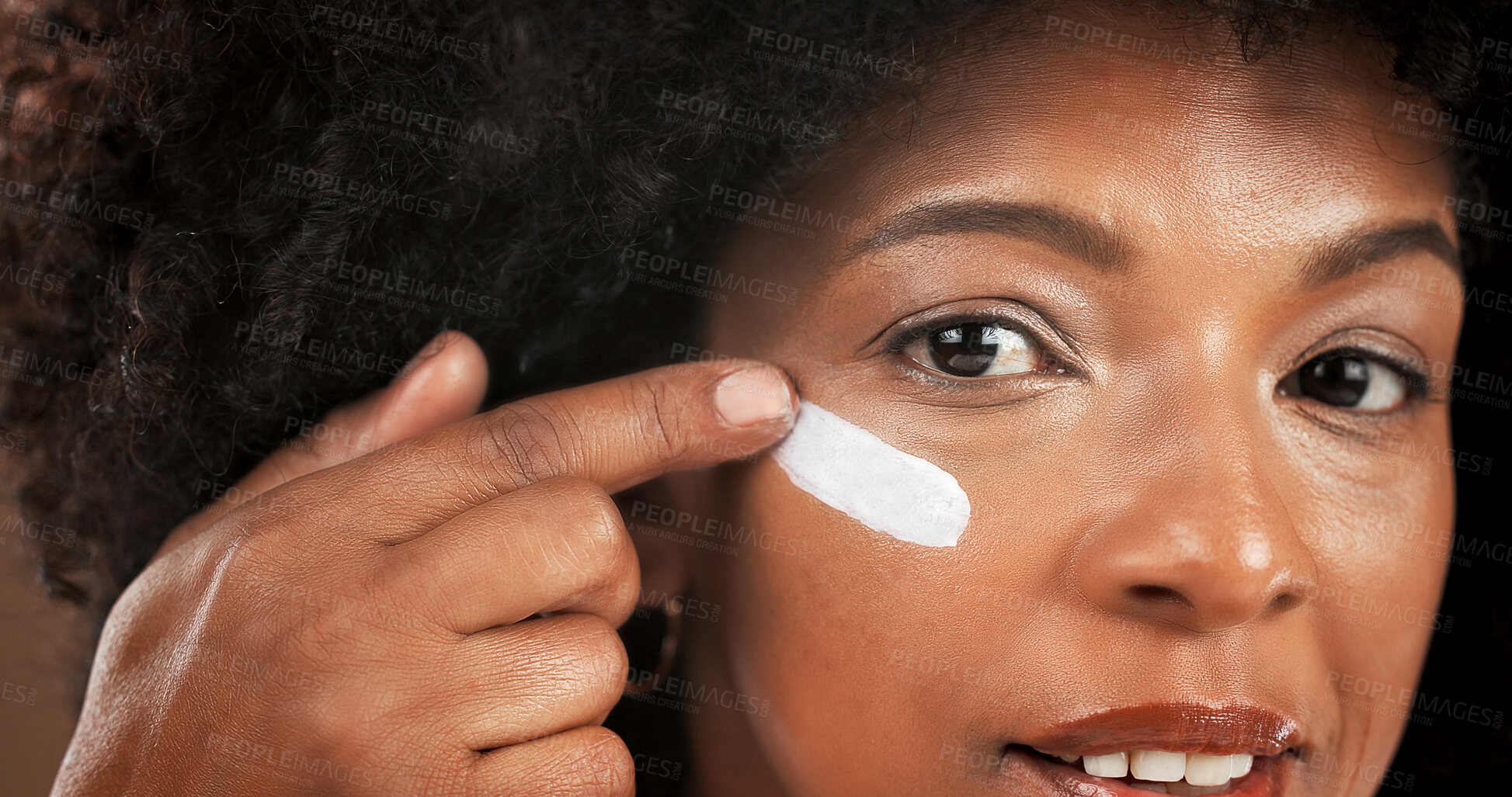 Buy stock photo Beauty, woman and portrait with face cream in studio for hydration, moisturizer or hyaluronic acid. Skincare, glow and african person with SPF lotion on brown background for anti aging and cosmetics