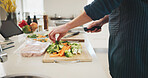 Food, hands and person cutting vegetables in home for cooking healthy dinner, meal or supper for diet. Knife, groceries and chef chopping ingredients for wellness, nutrition or recipe in kitchen.