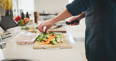 Buy stock photo Food, hands and person cutting vegetables in home for cooking healthy dinner, meal or supper for diet. Knife, groceries and chef chopping ingredients for wellness, nutrition or recipe in kitchen.