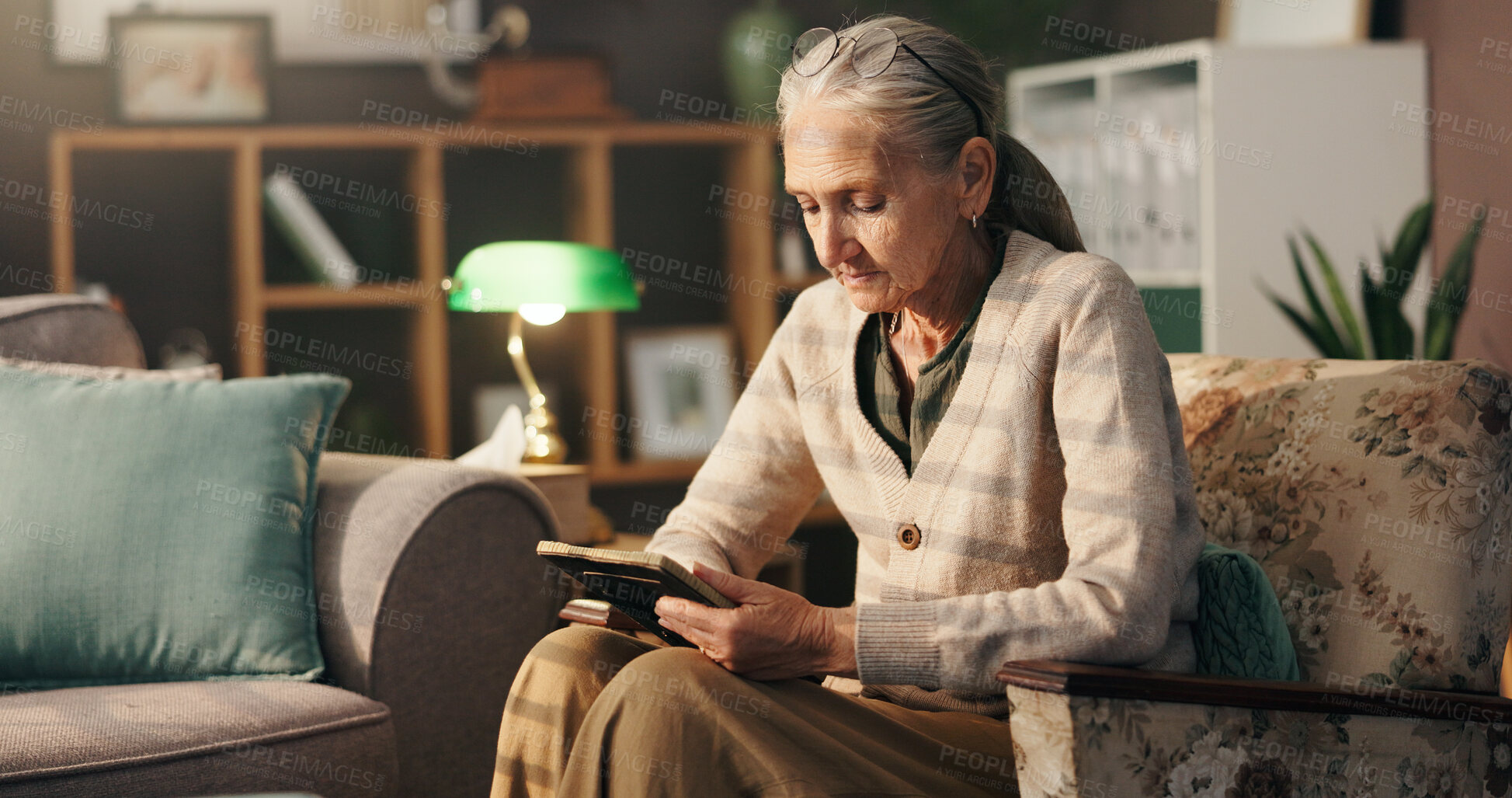Buy stock photo Grief, old woman and sad with picture frame in home for mourning, remember and lonely in retirement. Senior widower, person with depression and photograph on sofa for sorrow, memory and broken heart