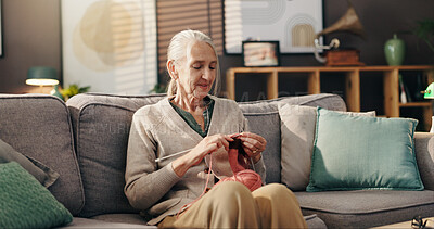 Buy stock photo Senior woman, relax and knit on sofa for retirement hobby, cognitive stimulation and DIY scarf. Wool, yarn or old person with craft in home for handmade jersey, peaceful activity and organic creation