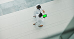 Men, doctor and medical team with tablet screen above at hospital for research and development. Top view, male people or healthcare employees walking with technology display or mockup space for app