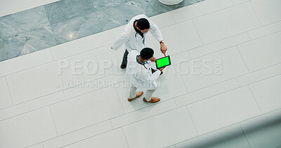 Buy stock photo Men, doctor and medical team with tablet screen at hospital for research and development above. Top view, male people or healthcare employees walking with technology display or mockup space for app
