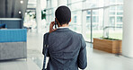 Back, phone call and black woman in office, communication or feedback for inflation analysis. African person, employee or financial advisor in hallway, cellphone or conversation with app for chatting