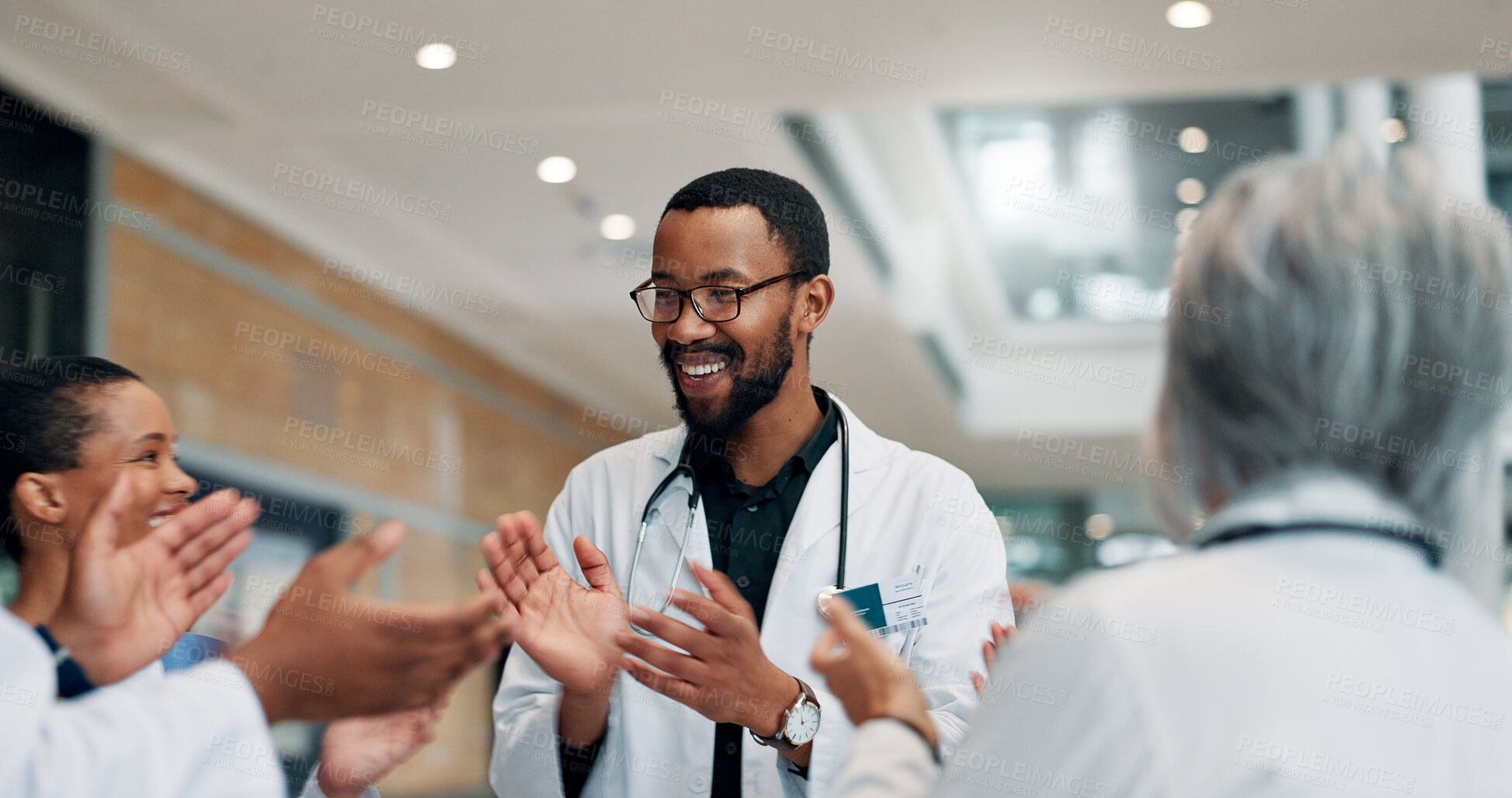 Buy stock photo Applause, doctor and group with smile, hospital and celebration for success, healthcare and meeting. Happy, medical professional and people with achievement in clinic, clapping and win for team