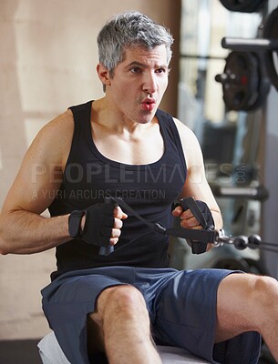 Buy stock photo Breathing, exercise and mature man with a cable row machine, workout goals and wellness with health, power and strong. Male person, athlete and gym equipment for training, progress and challenge