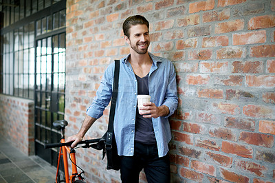 Buy stock photo Coffee, smile and man with bicycle, travel and break with eco friendly transport. Happy person, wall and biker with herbal tea, pride and cyclist with journey, joyful and confidence in lobby