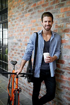 Buy stock photo Man, portrait and bicycle at wall with coffee, smile and confident designer with low carbon footprint. Creative employee, bike or happy at building for eco friendly and sustainable transport in Italy