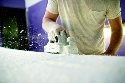 Buy stock photo Hand, sanding and surfboard with person in workshop for maintenance, production or repair. Equipment, manufacturing and power tools with small business owner in studio of surf shop for shaping