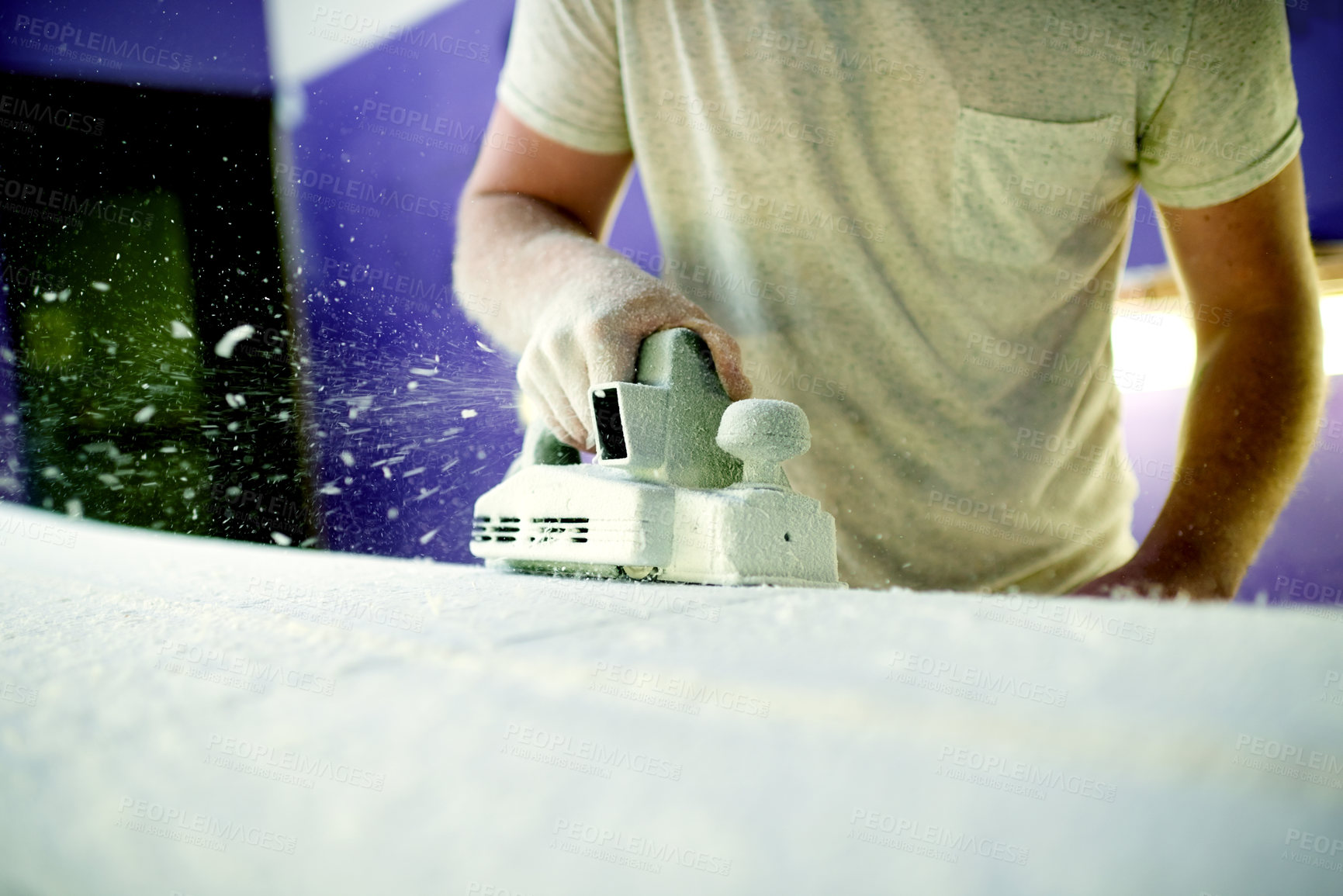 Buy stock photo Hand, sanding and surfboard with person in workshop for maintenance, production or repair. Equipment, manufacturing and power tools with small business owner in studio of surf shop for shaping