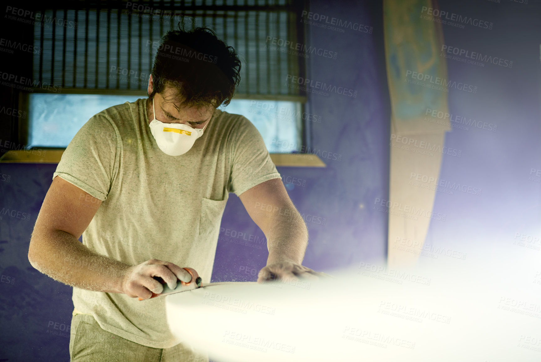 Buy stock photo Workshop, man and tools with surfboard for shape, manufacturing and creativity for handmade design. Factory, male person and entrepreneur with equipment for maintenance, craft creation and face mask