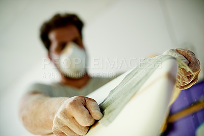Buy stock photo Man, hands and surfboard in workshop for sanding, small business and equipment service for water sport. Male person, craft and board in startup for shaping, maintenance and PPE for safety from below