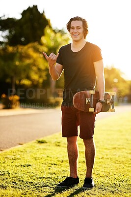 Buy stock photo Laugh, portrait and skateboarder with shaka hand gesture outdoor for hobby, skill practice and cruising. Male person, smile and hang loose in summer for urban fun, freedom and extreme sports